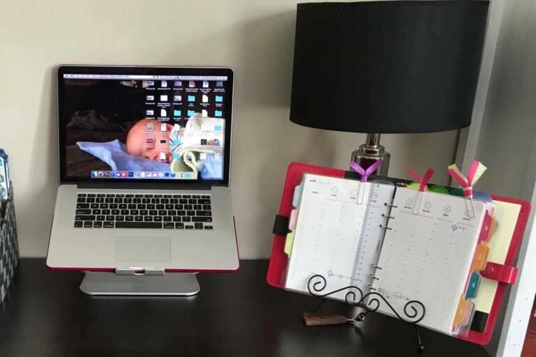 desk with laptop and planner