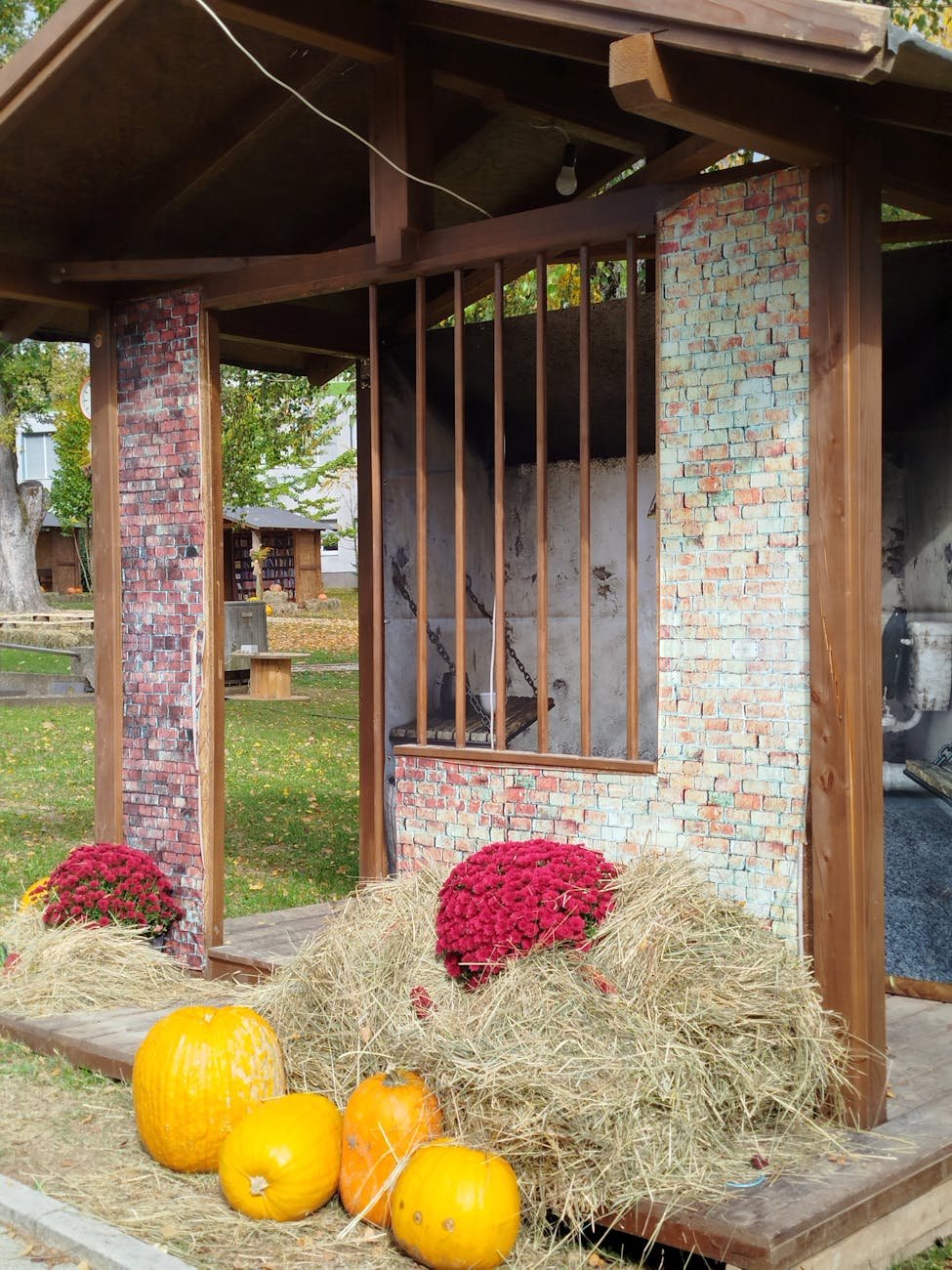 autumn harvest display with pumpkins and hay